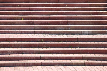 Steps in the sidewalk tile as a background