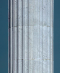 White architectural pillars on the building as a background