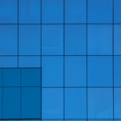 Blue windows in the house as an abstract background