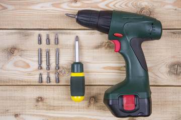 Screwdriver, tools on a wooden background. Top view. Copy space.