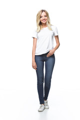 attractive girl in white shirt and jeans looking at camera isolated on white