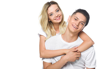smiling girlfriend hugging boyfriend isolated on white