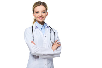 Fototapeta premium beautiful doctor in white coat with stethoscope posing with crossed arms, isolated on white