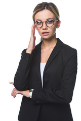 stylish young businesswoman in black jacket and eyeglasses isolated on white