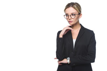 thoughtful young businesswoman in stylish suit looking away isolated on white