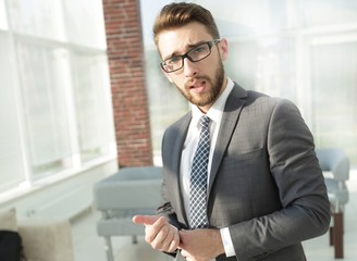 Portrait of a modern businessman sitting at his desk.