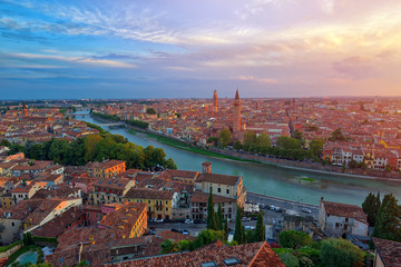 Fototapeta na wymiar Panoramic aerial view of Verona, Italy at summer sunset, sun lens flare