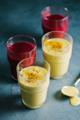 Golden yogurt milk with turmeric and red smoothie
