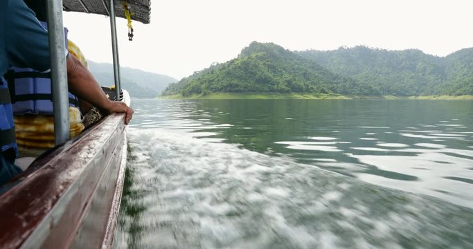 Boat ride at Khun Dan Prakan Chon dam at Nakhon Nayok province in thailand. The park is the largest area of virgin forest in middle Thailand and is a remnant of rain forest which is older.