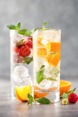 Summer drinks with strawberry and orange