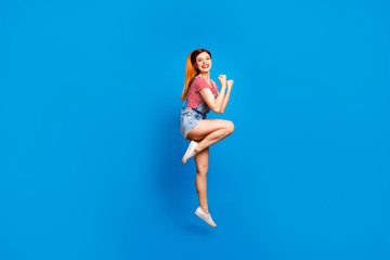 Fototapeta na wymiar Youngster youth emotion expressing concept. Full length body size photo studio shoot of cool trendy lovely joyful cheerful glad satisfied lady jumping up isolated bright color vivid background