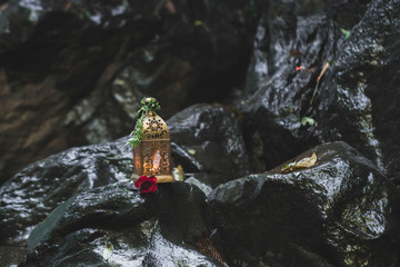Evening wedding ceremony with vintage forged lamps and candles inside