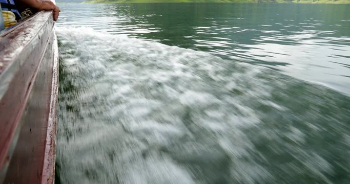 Boat ride at Khun Dan Prakan Chon dam at Nakhon Nayok province in thailand. The park is the largest area of virgin forest in middle Thailand and is a remnant of rain forest which is older.