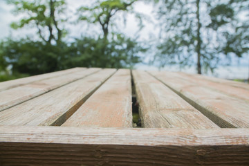 Fototapeta premium Empty wood table top on blur abstract background