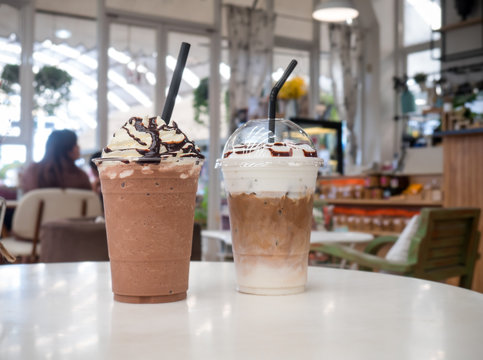 Latte Frappe, Chocolate Frappe On White Table At Coffee Shop.