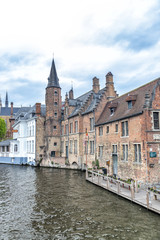 Fototapeta na wymiar Bruges city buildings along the canal, Belgium