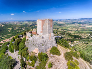Fototapeta na wymiar Aerial view of beautiful castle in the countryside in summer season, Tuscany
