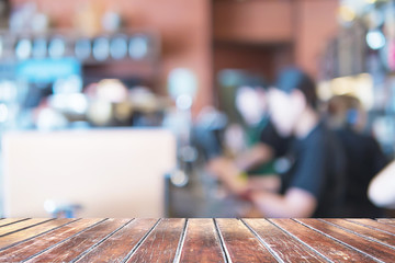 Wooden shelf over blurred coffee shop background