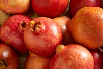 Overhead view of bunch of fresh pomegranates