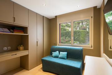 Elegant study with sofa, window and television