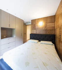 Bedroom with parquet in modern apartment