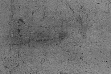 Wall fragment with scratches and cracks