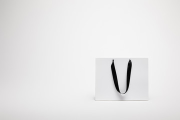 one black and white shopping bag isolated on white
