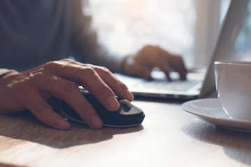 Man clicking computer mouse