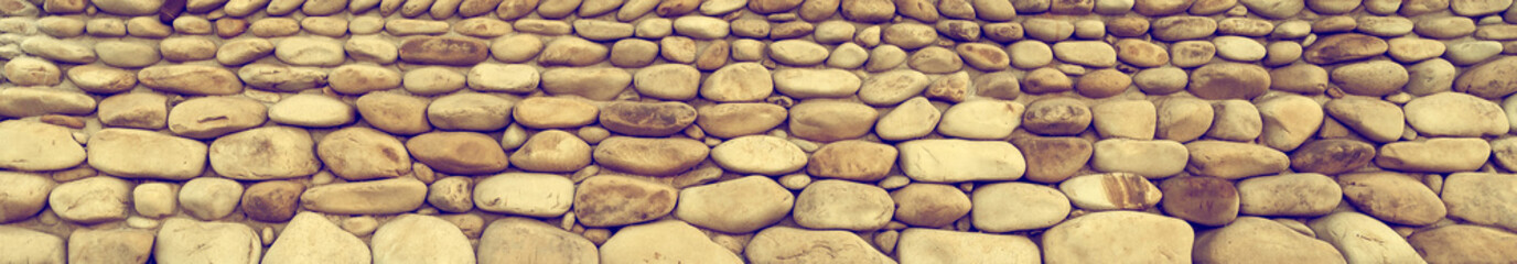 Stone laying of an old wall with toning