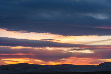 picturesque view of beautiful sunset sky over mountain silhouettes 