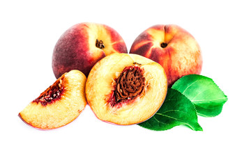Peach fruit half with leaf isolated on white background