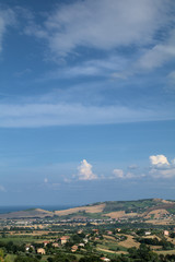 Obraz premium panorama,landscape,Italy,summer,hills,horizon,sea,sky,blue,clouds,cumulus,countryside,crops,view,agriculture