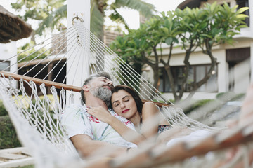 Couple resting together in a hammock