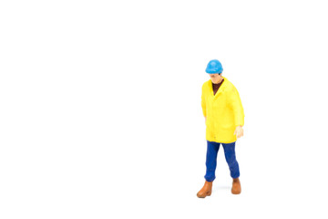 Miniature people engineer worker construction on white background with a space for text