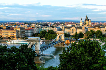 Fototapeta na wymiar Chain bridge on Danube river in Budapest city. Hungary. Urban landscape panorama with old buildings and domes of opera