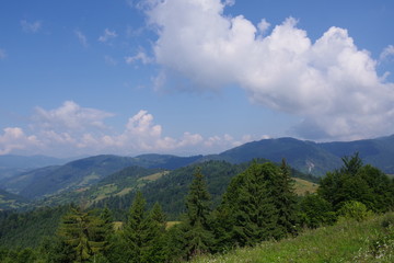 Fototapeta premium mountains of green and blue sky