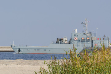 SMALL LANDING CRAFT - The war ship in fairway flows from port   © Wojciech Wrzesień