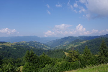 mountains of green and blue sky