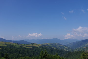 Fototapeta na wymiar mountains of green and blue sky