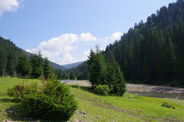 Fototapeta premium mountain river and blue sky