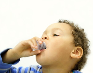 Sick child taking medicine stock photo