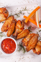 Hot and spicy hot meat dishes. Buffalo Grilled chicken wings with red spicy sauce