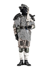 Post apocalyptic soldier in black mask and glasses, wool field cap and handmade armor from car tires and hauberk, standing at attention with submachine gun on shoulder, isolated on white studio shoot