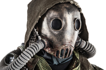 Close up portrait of nuclear post-apocalypse survivor, living underground mutant or creature, skilled stalker wearing rags and armored full-face gas mask or air breathing apparatus, toned shoot - obrazy, fototapety, plakaty