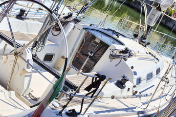 A glimpse of a fully equipped sailboat moored at the port