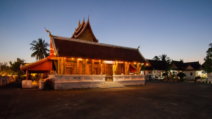 Fototapeta premium Buddhist temple in Luang Prabang, Laos, at night.