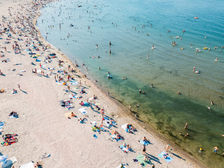 Fototapeta na wymiar Aerial Drone View Of People Having Fun And Relaxing On Beach