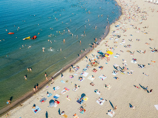 Aerial Drone View Of People Having Fun And Relaxing On Beach