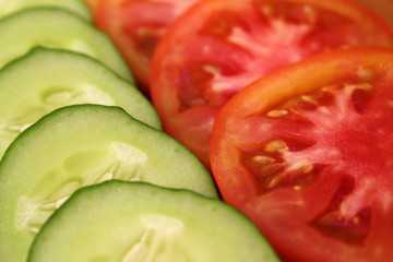 fresh cucumbers and tomatoes cut into slices