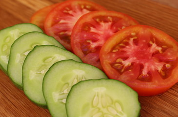 fresh cucumbers and tomatoes cut into slices